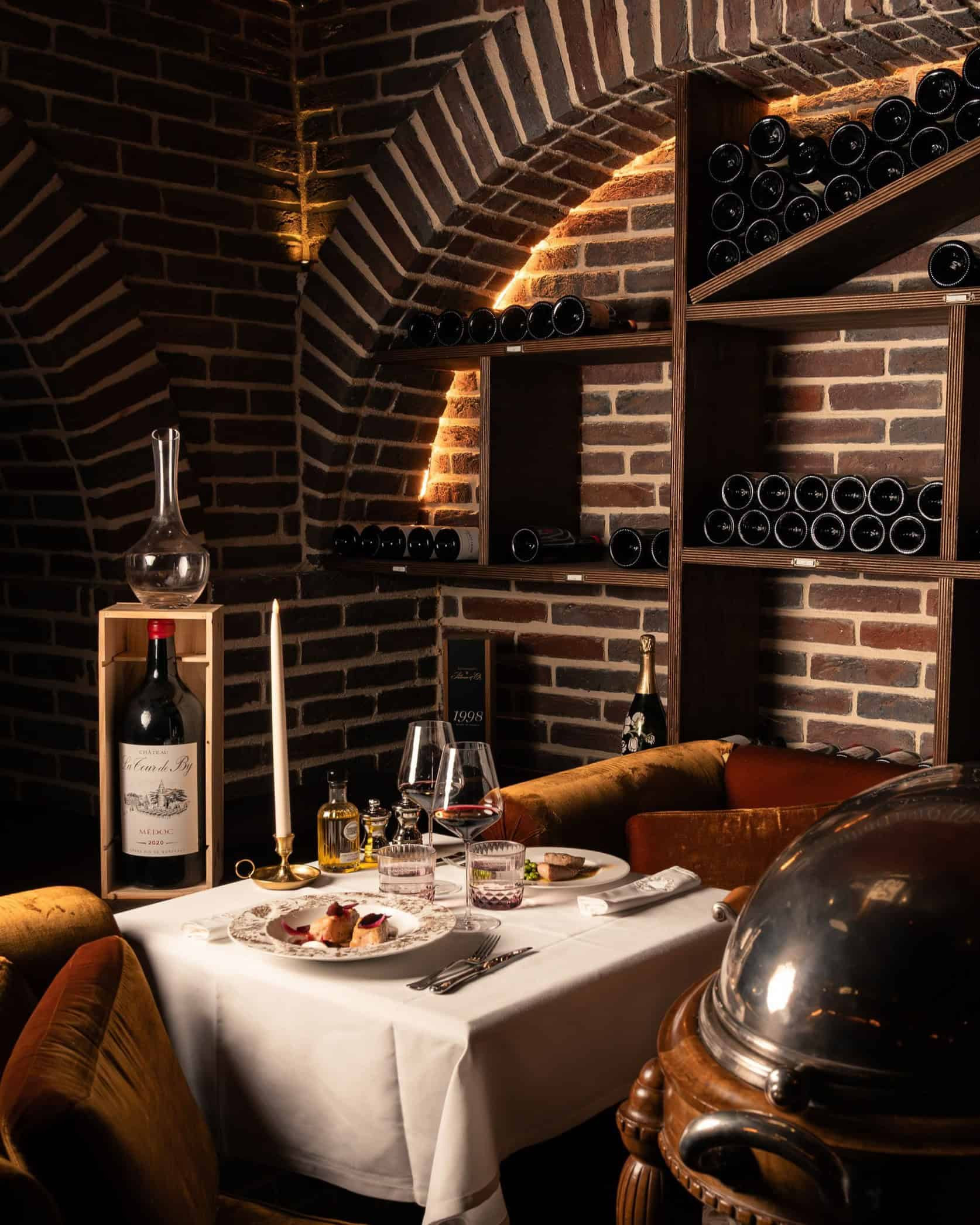 Elegant table at the wine cellar of boutique hotel Maison Maubreuil in Nantes. 